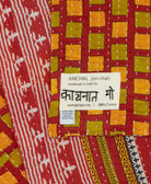 small kantha blanket with signature of the maker on the tag