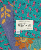 small kantha blanket with signature of the maker on the tag