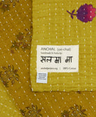 small kantha blanket with signature of the maker on the tag