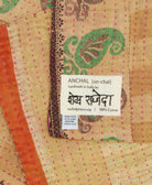 small kantha blanket with signature of the maker on the tag