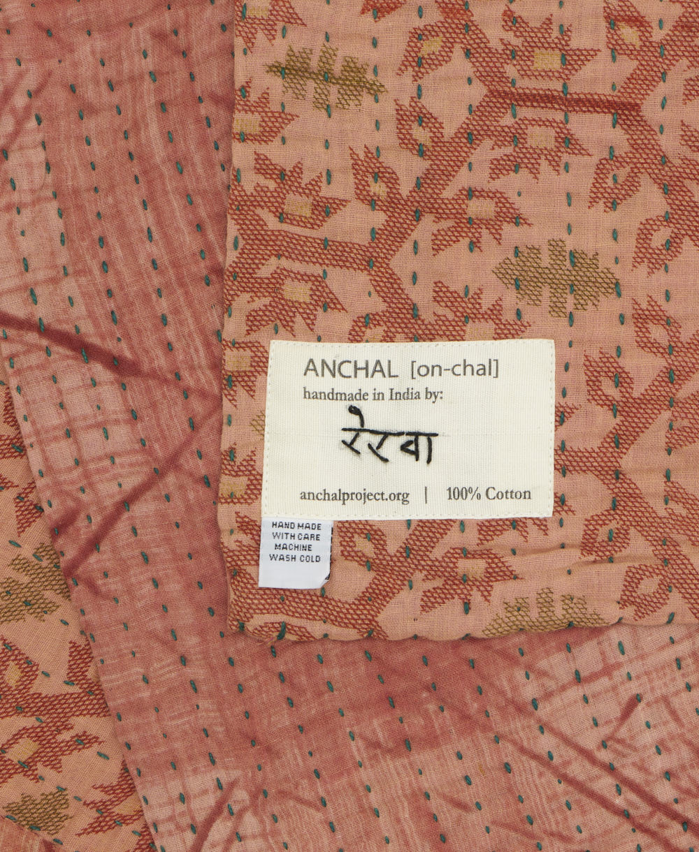 small kantha blanket with signature of the maker on the tag