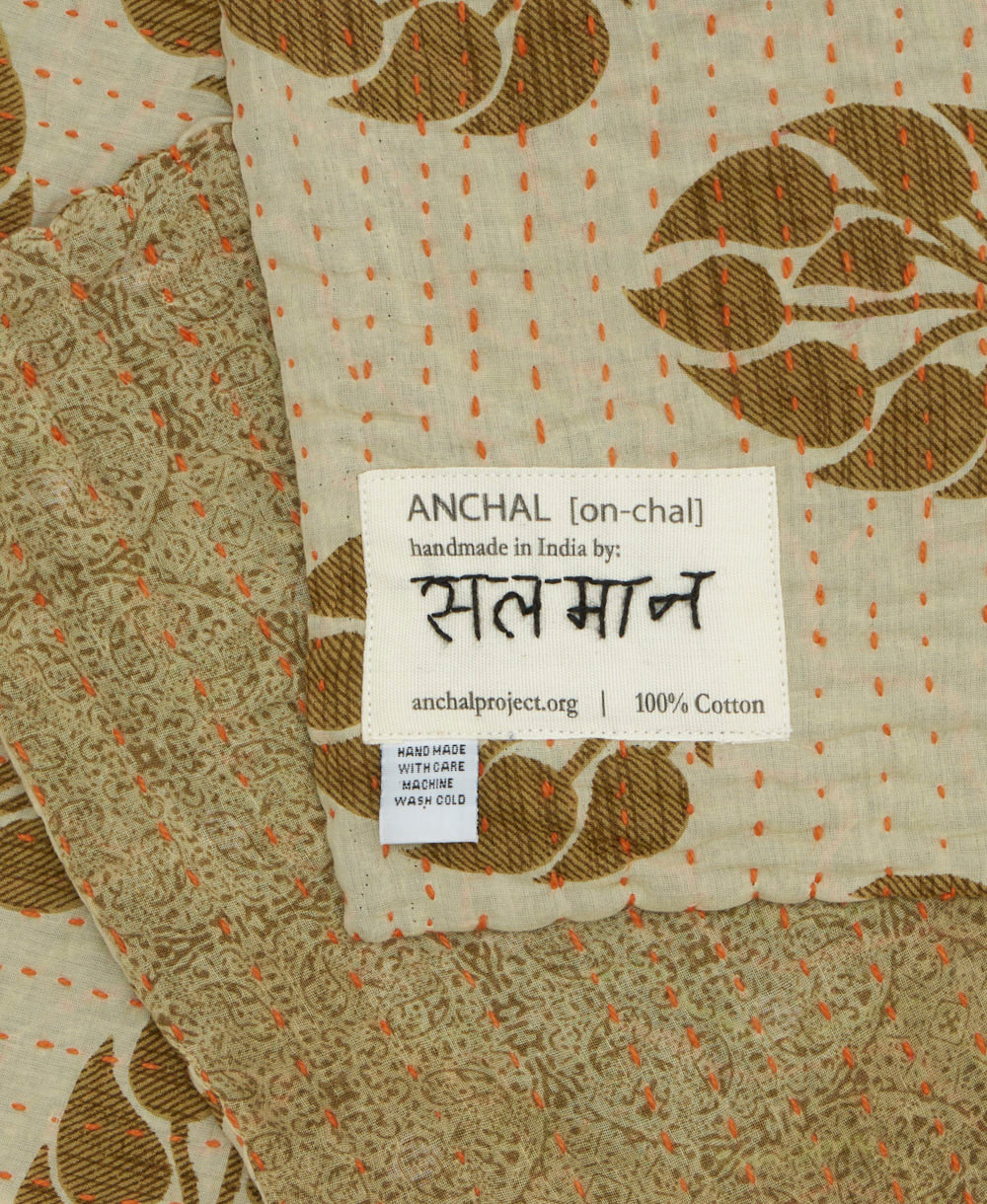 small kantha blanket with signature of the maker on the tag