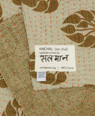 small kantha blanket with signature of the maker on the tag