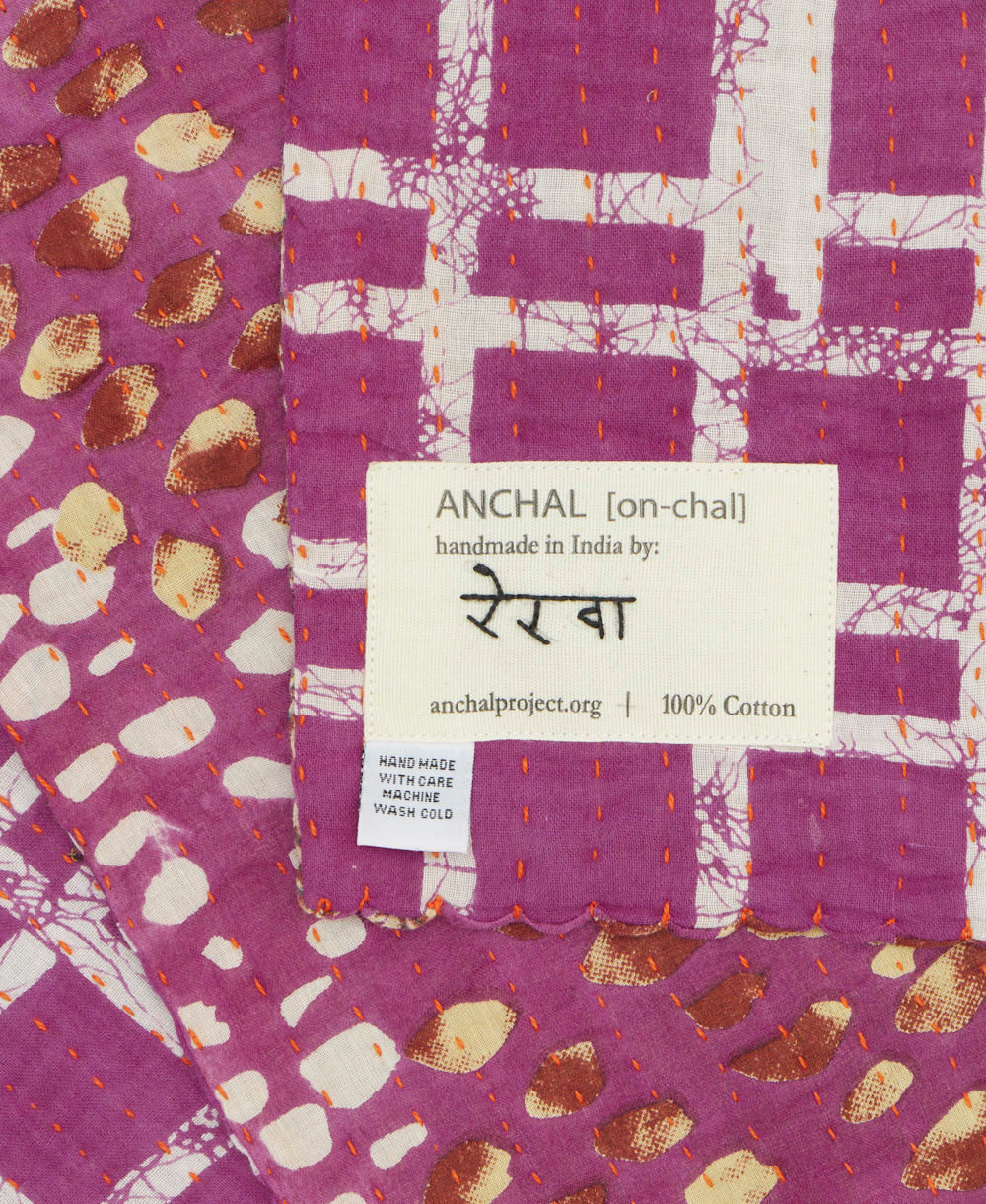 small kantha blanket with signature of the maker on the tag