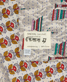 small kantha blanket with signature of the maker on the tag