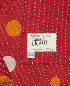 small kantha blanket with signature of the maker on the tag