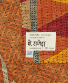 small kantha blanket with signature of the maker on the tag