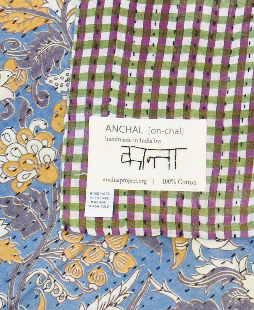 small kantha blanket with signature of the maker on the tag