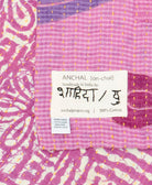 small kantha blanket with signature of the maker on the tag