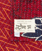 small kantha blanket with signature of the maker on the tag