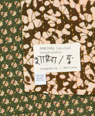 small kantha blanket with signature of the maker on the tag
