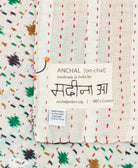 small kantha blanket with signature of the maker on the tag