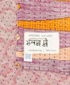 small kantha blanket with signature of the maker on the tag