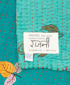 small kantha blanket with signature of the maker on the tag