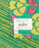 small kantha blanket with signature of the maker on the tag