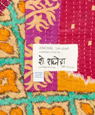 small kantha blanket with signature of the maker on the tag