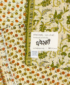 orange and green small Kantha quilt throw featuring the hand-stitched
signature of the maker