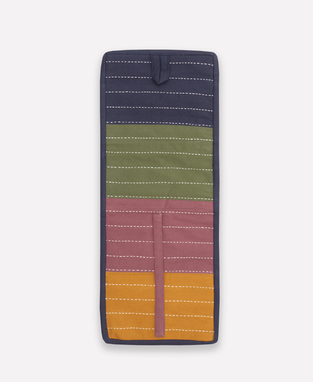 colorful small travel organizer in shades of navy blue, pine green, plum berry, and ochre yellow