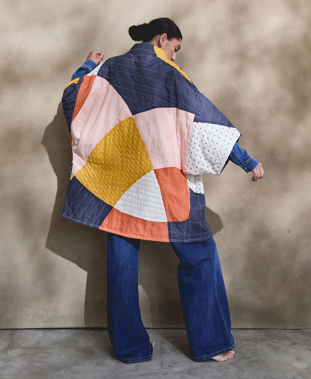 colorful quilted jacket in cocoon silhouette featuring rainbow organic patchwork shapes