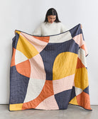 modern patchwork quilt in colorful organic shapes handmade in India by women artisans