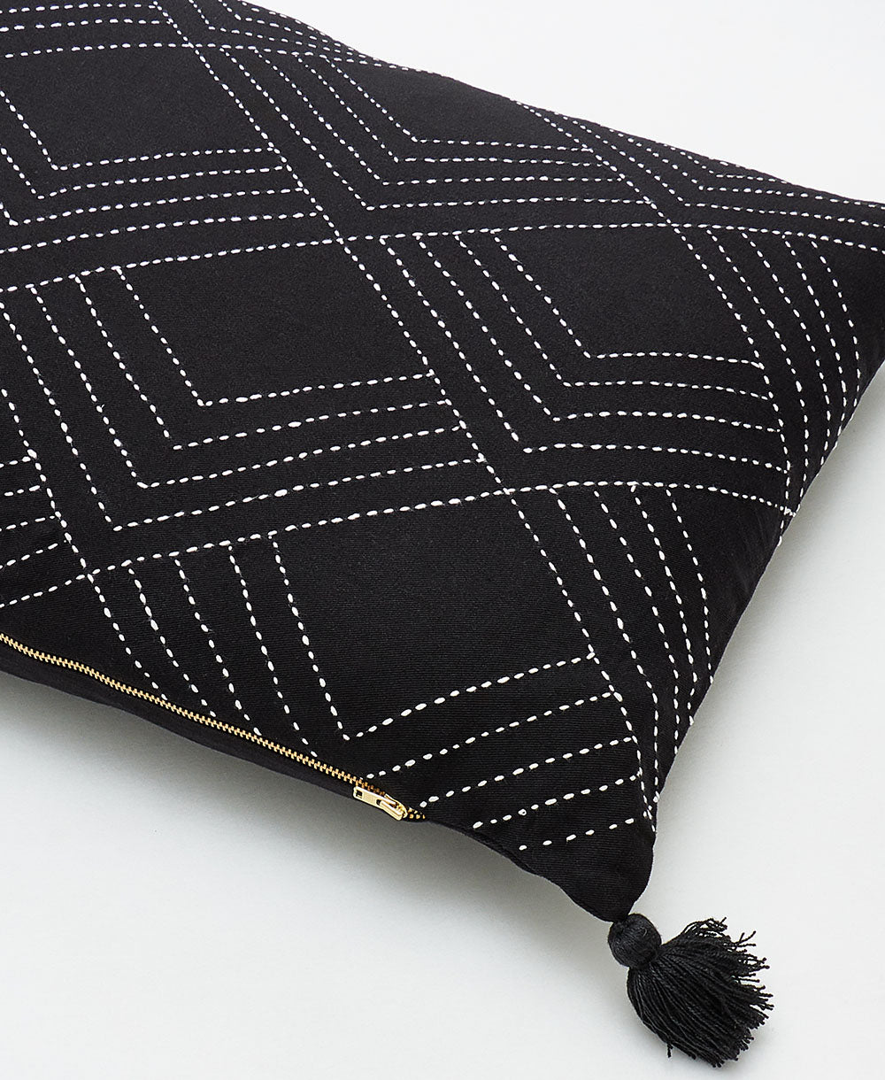 ethically made black lumbar pillow with removable down feather insert and gold zipper