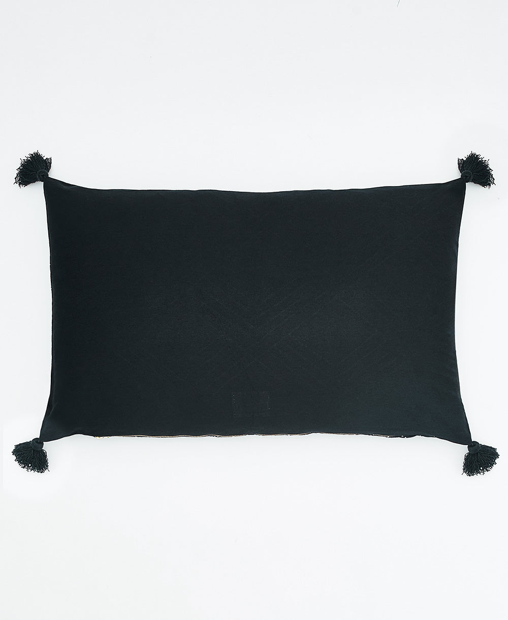 back of tilt lumbar throw pillow with black tassels made from 100% organic cotton