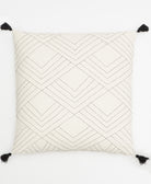 tilt throw pillow in bone ivory with black tassels and black embroidery by Anchal