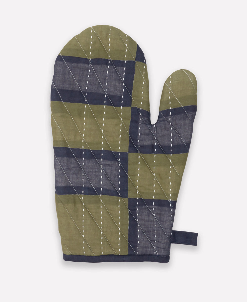 Quilted oven mitt with green and blue checkered pattern on a white background