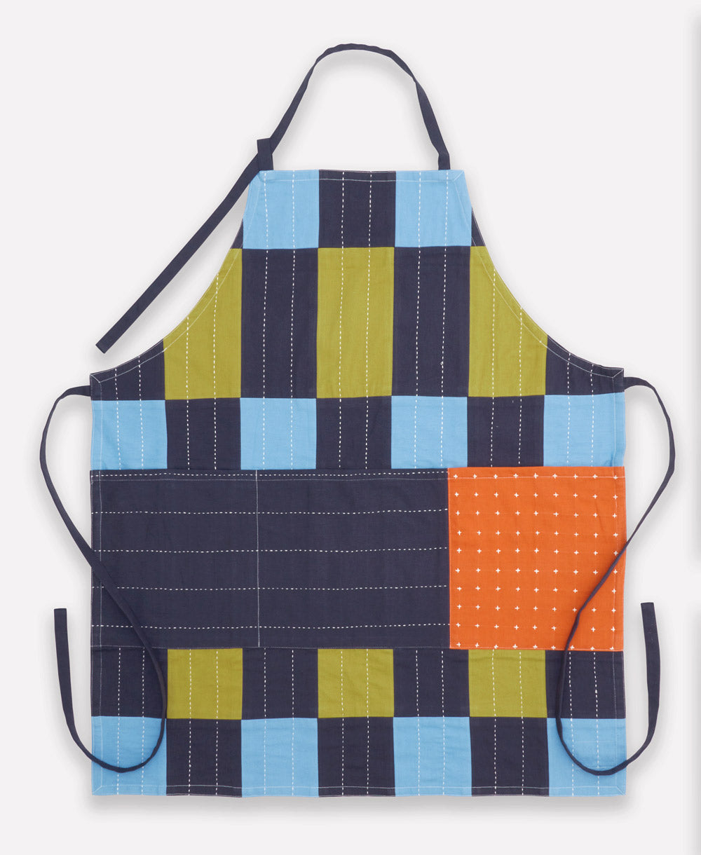 Colorful quilted apron with a patchwork pattern on a white background