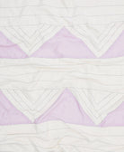 100% organic cotton baby quilt with purple and white diamond pattern