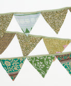 Set of colorful triangular fabric flags on a white background