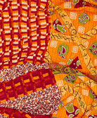 orange abstract kantha quilt featuring traditional hand sitiching 