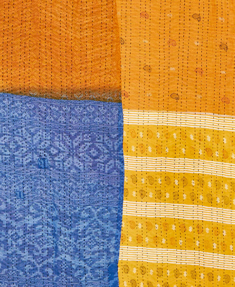 soft twin kantha blanket in a yellow paisley pattern made from upcycled vintage cotton saris