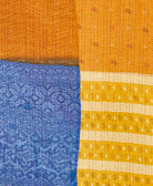 soft twin kantha blanket in a yellow paisley pattern made from upcycled vintage cotton saris