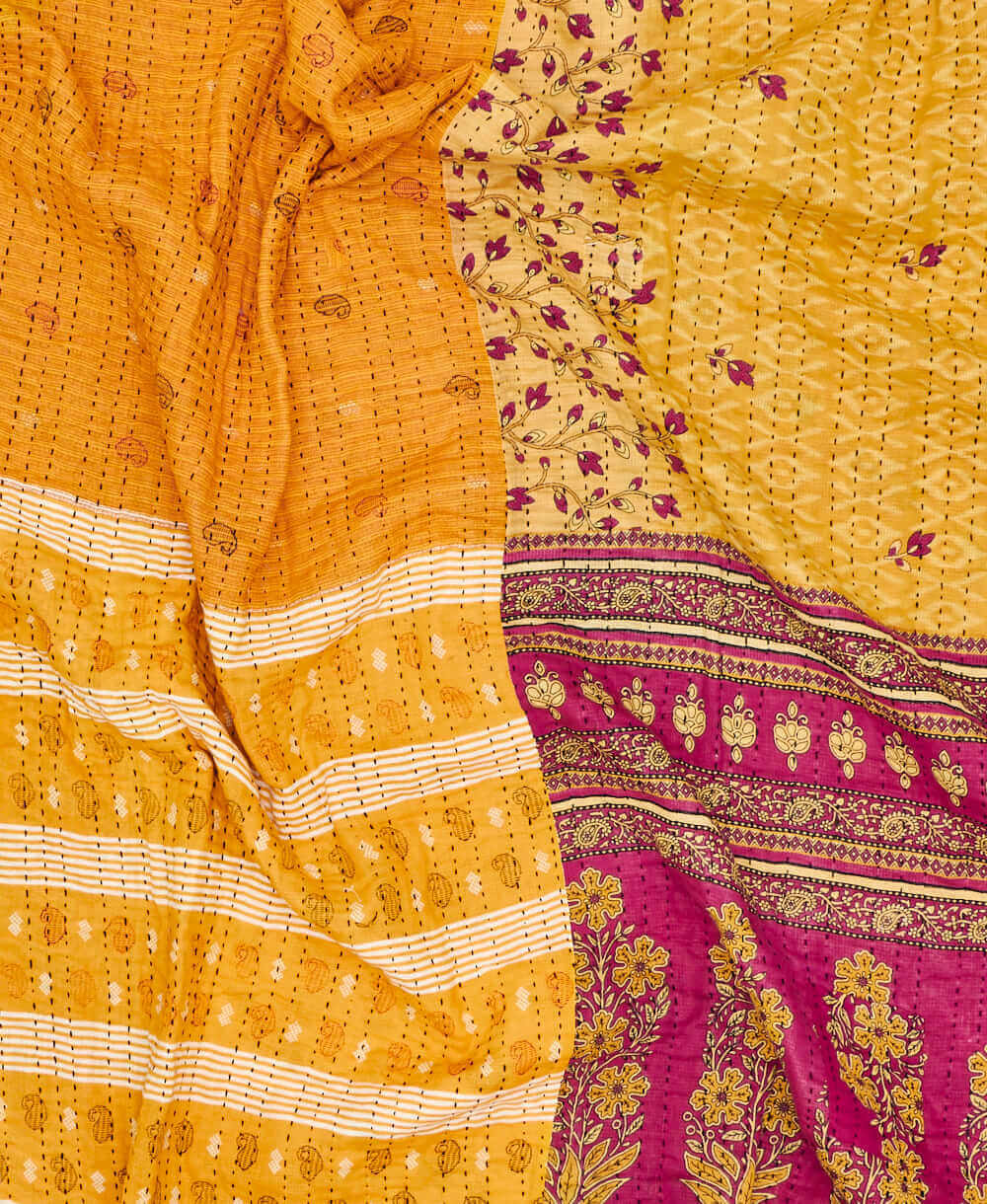 yellow paisley kantha quilt featuring traditional hand sitiching 