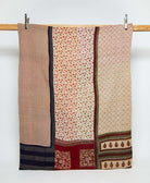 beige twin kantha quilt in a floral  pattern handmade in India