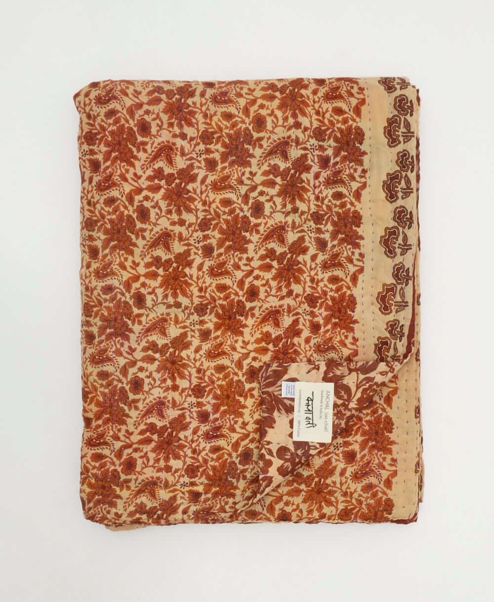 sustainable kantha quilt in twin size with a brown floral pattern