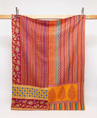 red twin kantha quilt in bold multi-colored stripe pattern handmade in India