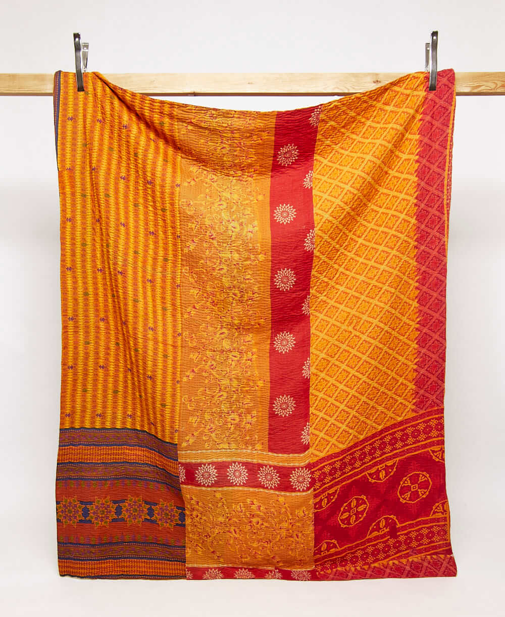 orange & red twin kantha quilt in a diamond pattern handmade in India