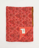 coral and red floral quilted throw in twin size handmade in India by Anchal artisans