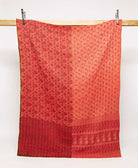 coral & red twin kantha quilt in a floral pattern handmade in India