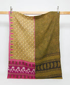 olive green twin kantha quilt in a hot pink floral pattern handmade in India