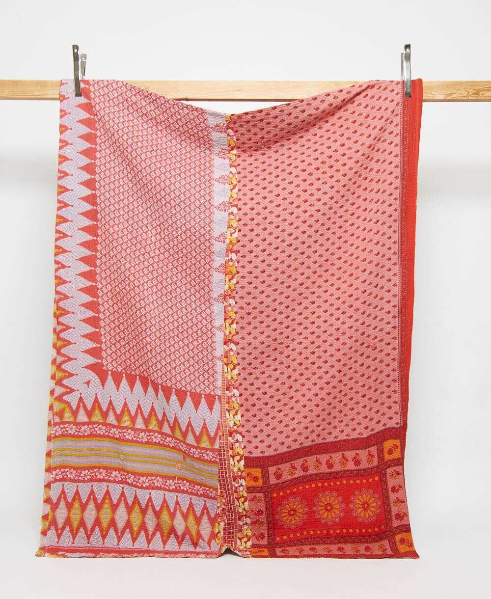 red & salmon pink twin kantha quilt in a floral pattern handmade in India