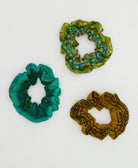 group of three one-of-a-kind unique green vintage cotton scrunchies on white background