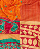 King kantha quilt with reversible orange paisley pattern
