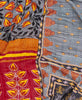 King kantha quilt with reversible grey and yellow floral pattern
