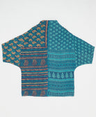 ethically made quilted jacket in a cerulean blue paisley print handmade by artisans in India