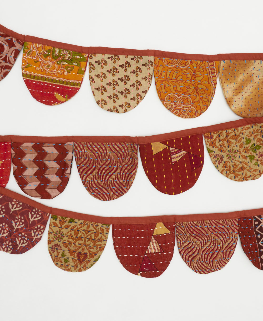ethically made party decor banner in rust red and other mixed red fabrics