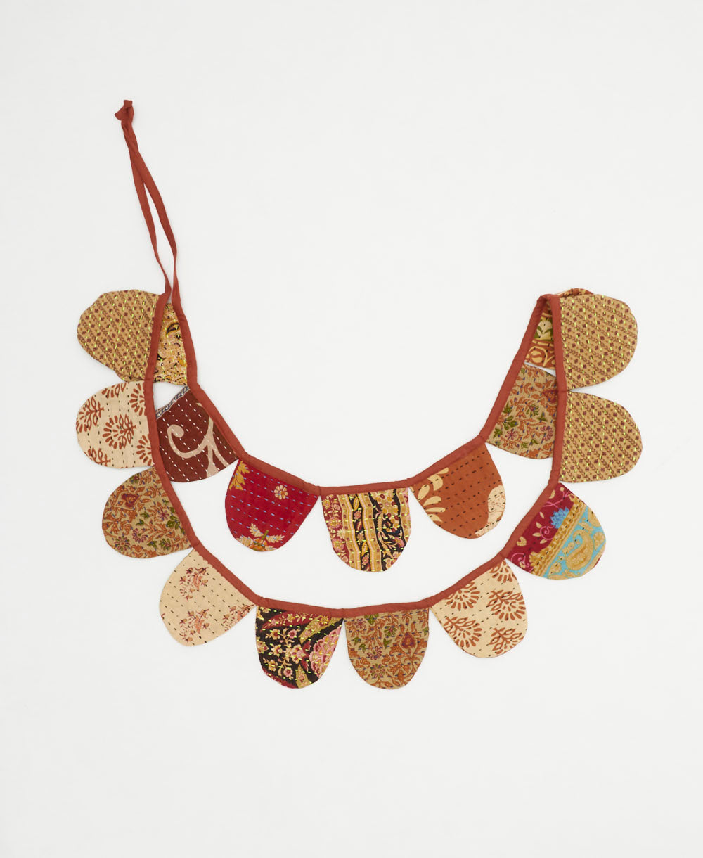 handmade kantha scallop banner in a tan & black paisley print