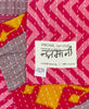 Colorful small Kantha quilt throw featuring the hand-stitched
signature of the maker